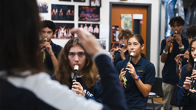 Classroom photo of students playing clarinets